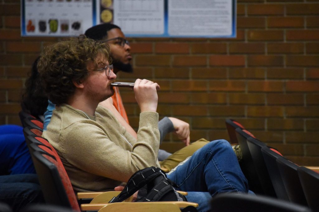Students Watch Fellow Presenters At The College Of Sciences Student Research Symposium.