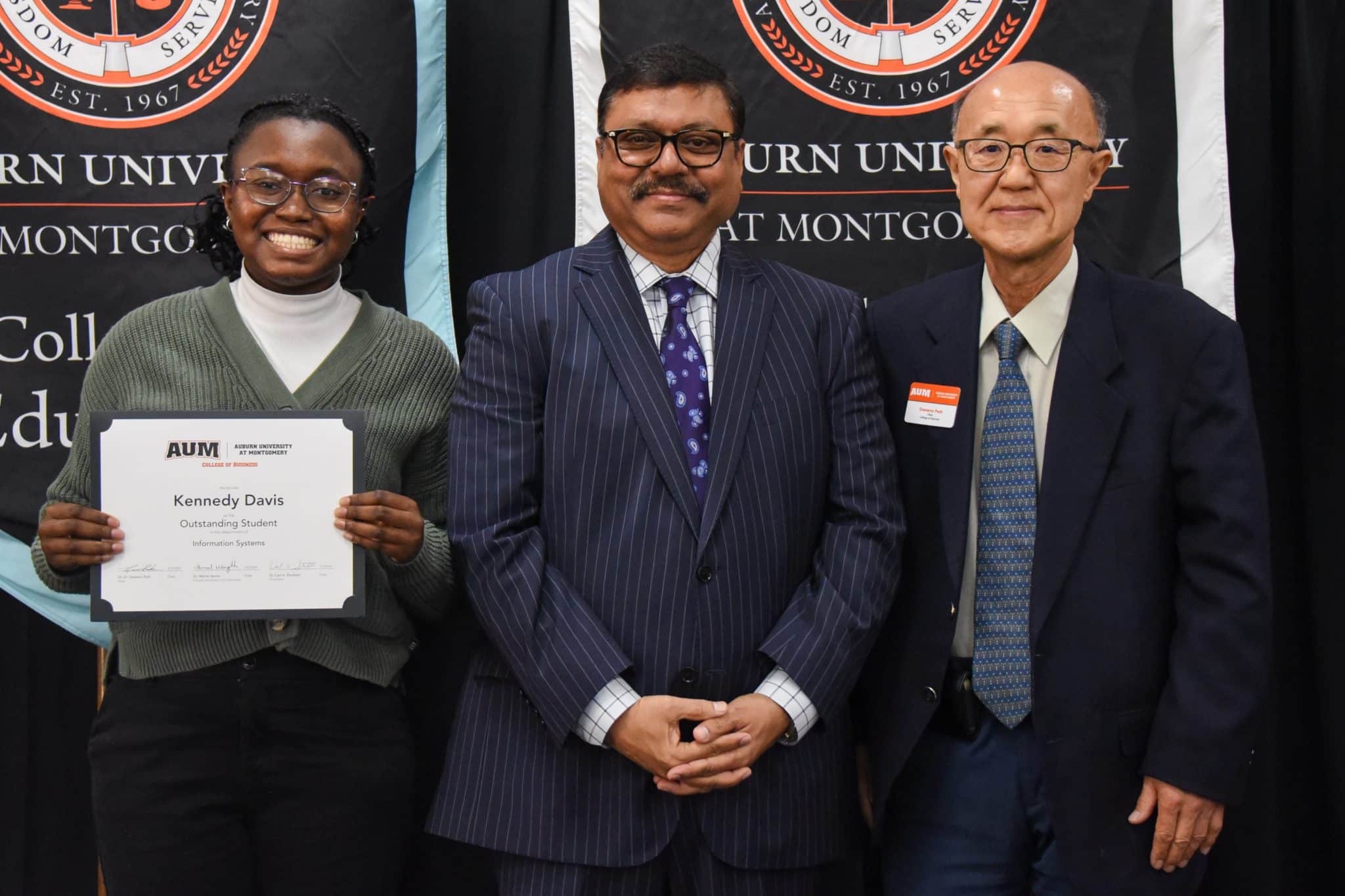 Kennedy Davis receiving an Outstanding Student award at Auburn University at Montgomery event.
