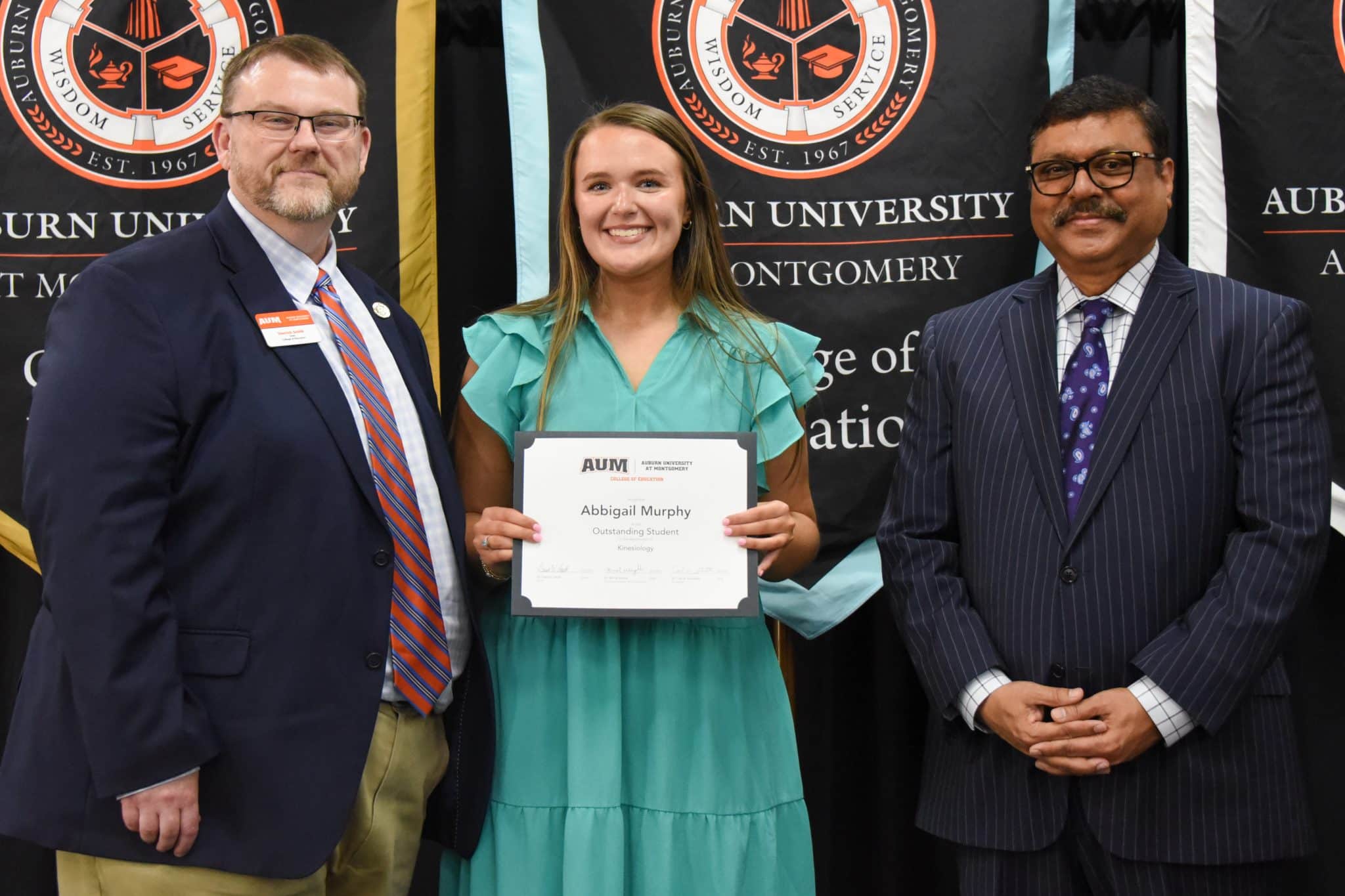 Abbigail Murphy receives Outstanding Student award at Auburn University at Montgomery ceremony.