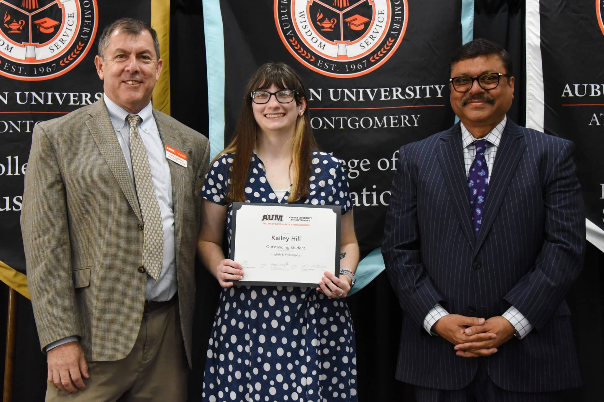 Kailey Hill receives an Outstanding Student award at Auburn University at Montgomery ceremony.