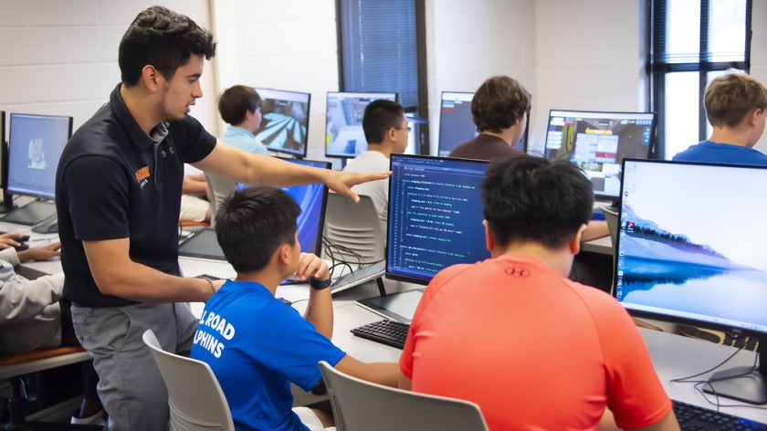 An Instructor Works With Two Young Learners During One Of Auburn University At Montgomery's Computer Science Summer Camps.