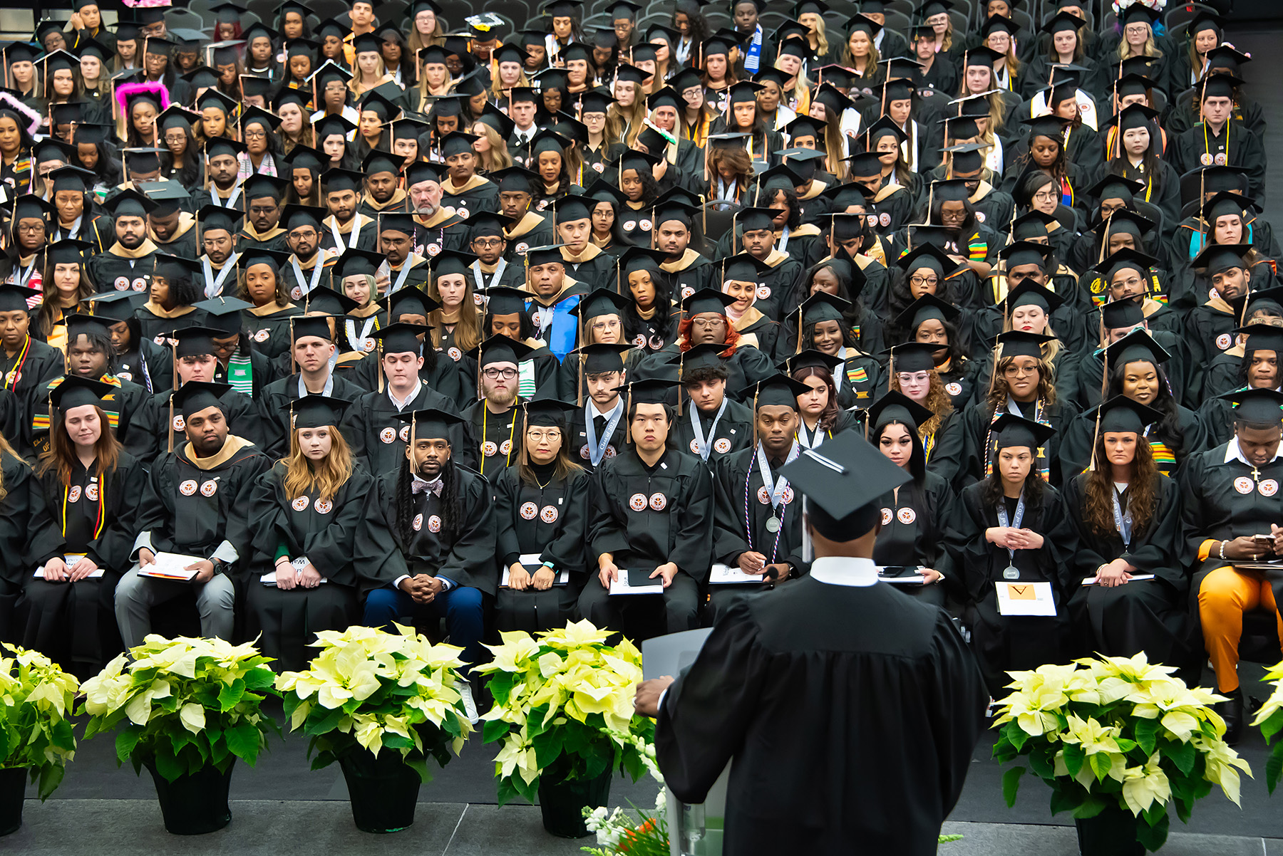 A speaker addresses Auburn University at Montgomery's Fall 2024 graduating class.