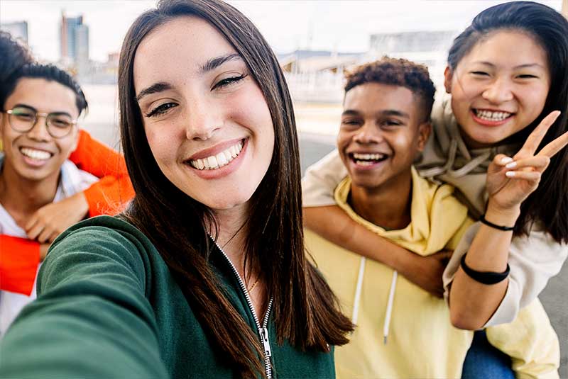 Group of happy college students smiling at the camera