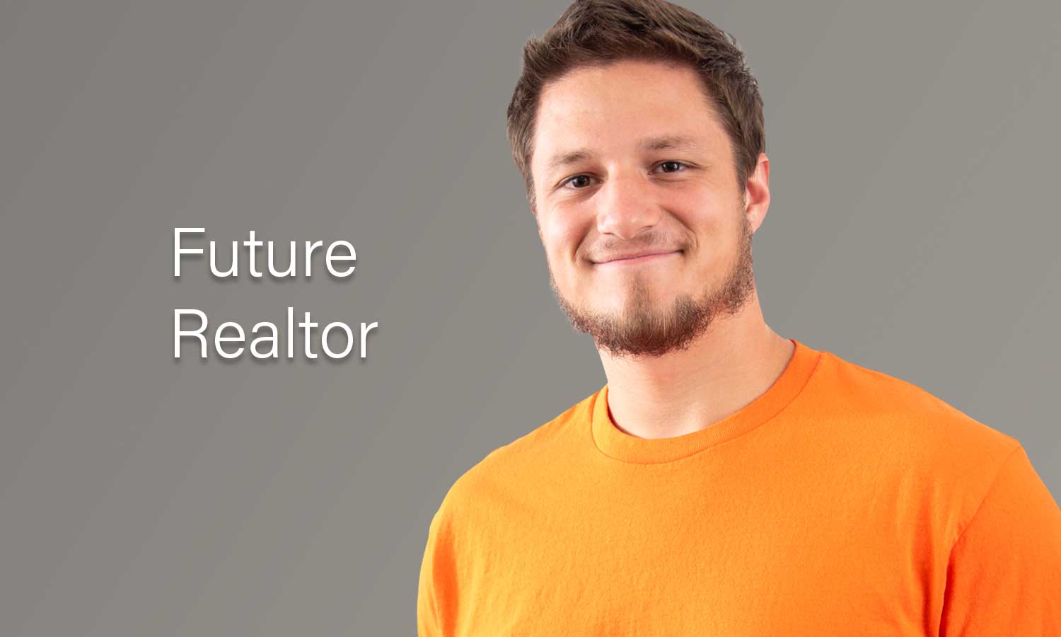 AUM student in orange shirt smiling with 'Future Realtor' text, Auburn University at Montgomery real estate career.