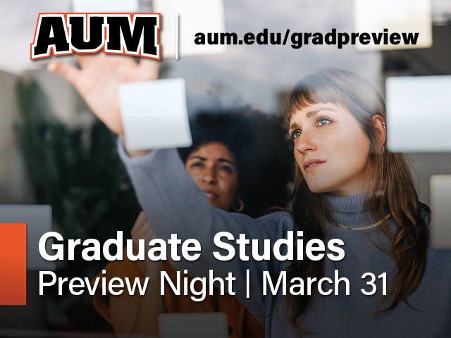 AUM Graduate Studies Preview Night on March 31; two students place notes on glass at Auburn University at Montgomery.
