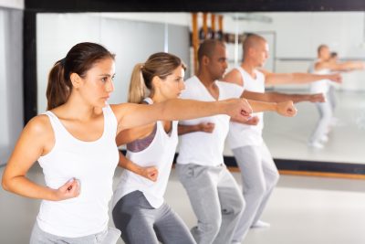 People practice punching in a self-defense training course.