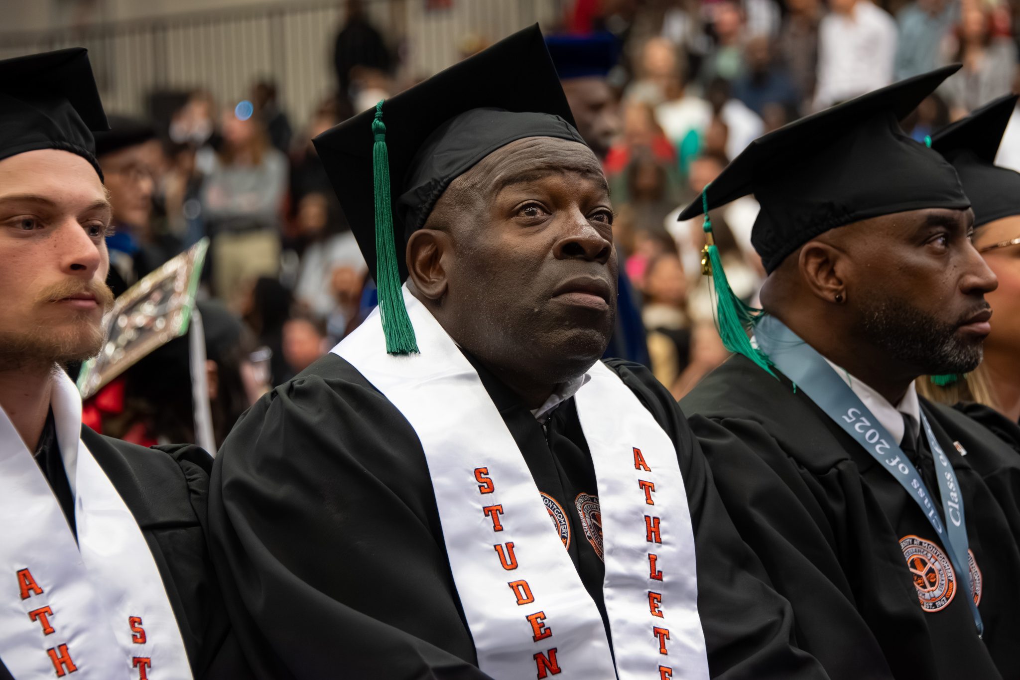 Auburn University at Montgomery commencement with student-athletes in caps and gowns during graduation ceremony