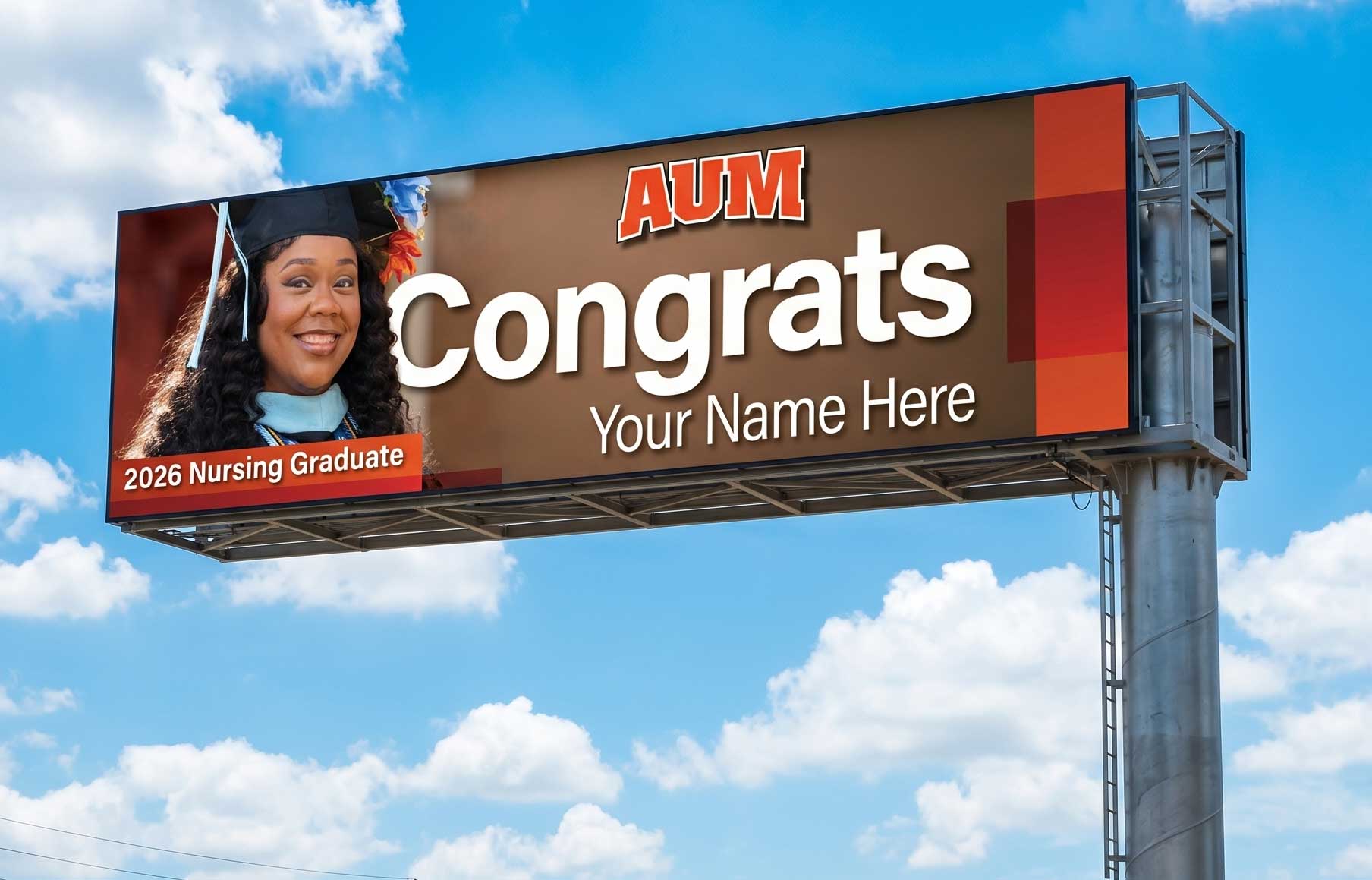 AUM billboard congratulating a 2026 nursing graduate; a woman in cap and gown smiles—Auburn University at Montgomery.