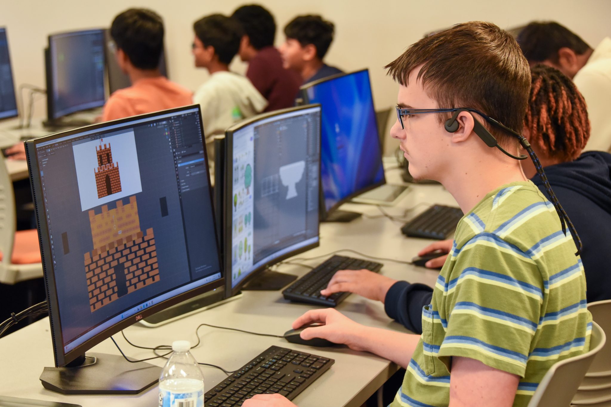 Auburn University at Montgomery student creates pixel art game assets in a computer lab during AUM game design class.