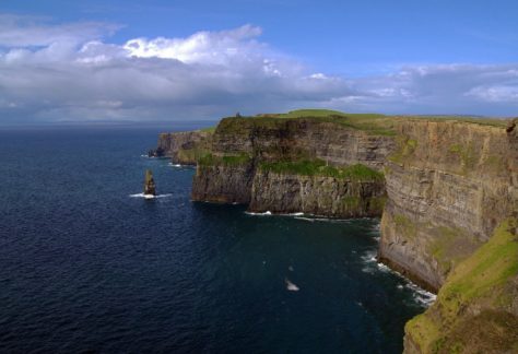 AUM study abroad: Cliffs of Moher in Ireland with dramatic Atlantic sea cliffs and blue skies