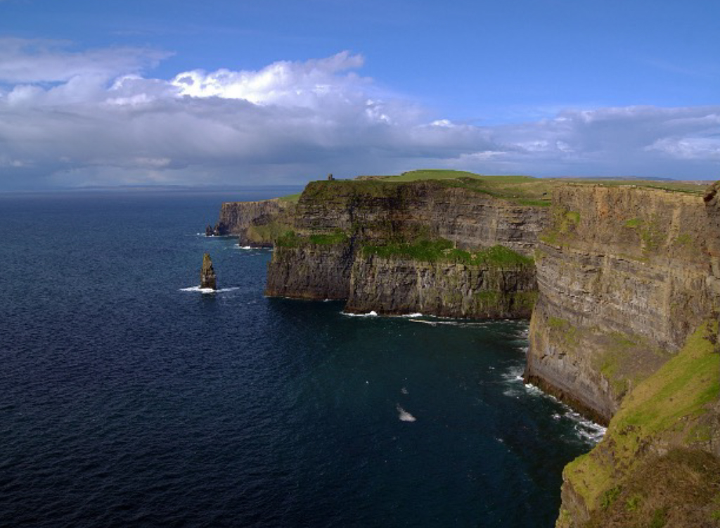 AUM study abroad: Cliffs of Moher in Ireland with dramatic Atlantic sea cliffs and blue skies