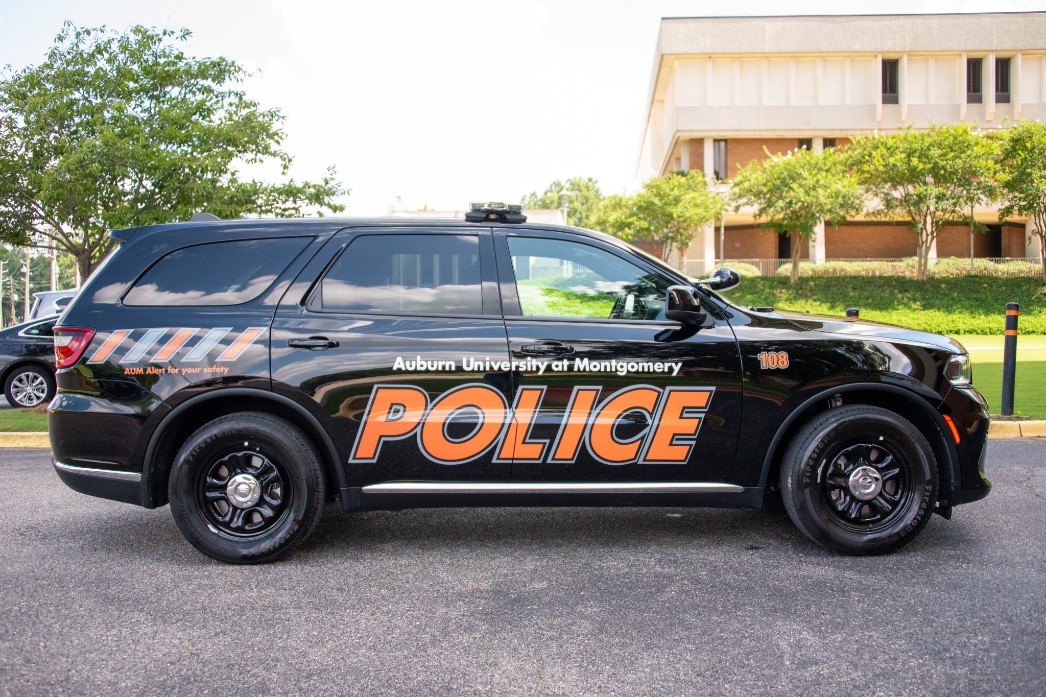 Auburn University at Montgomery Police SUV on campus, AUM patrol vehicle by academic building