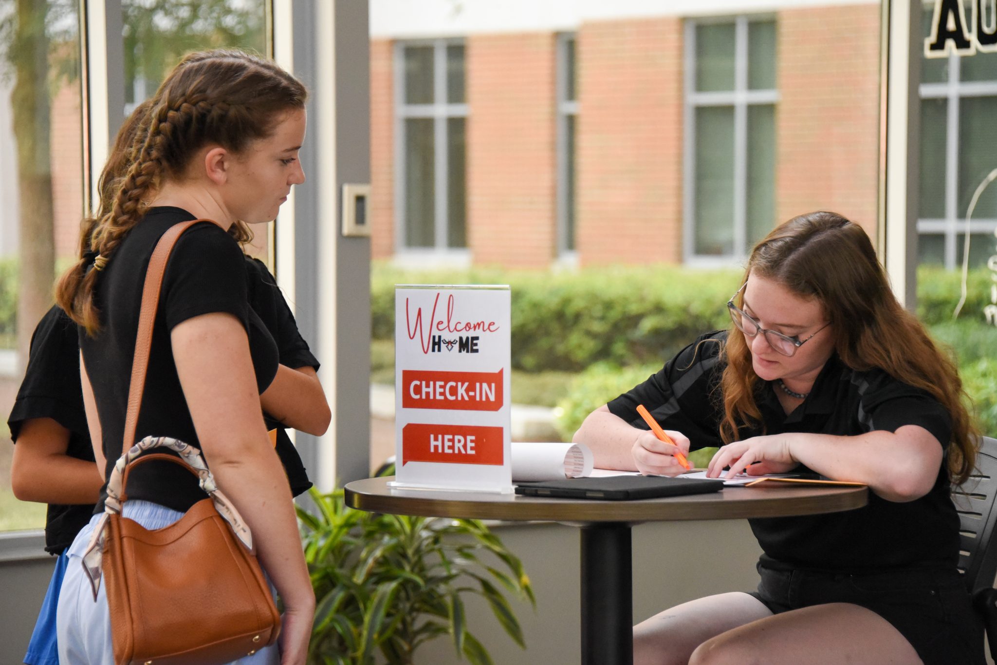 AUM housing Welcome Home check-in as a student registers with staff at Auburn University at Montgomery.