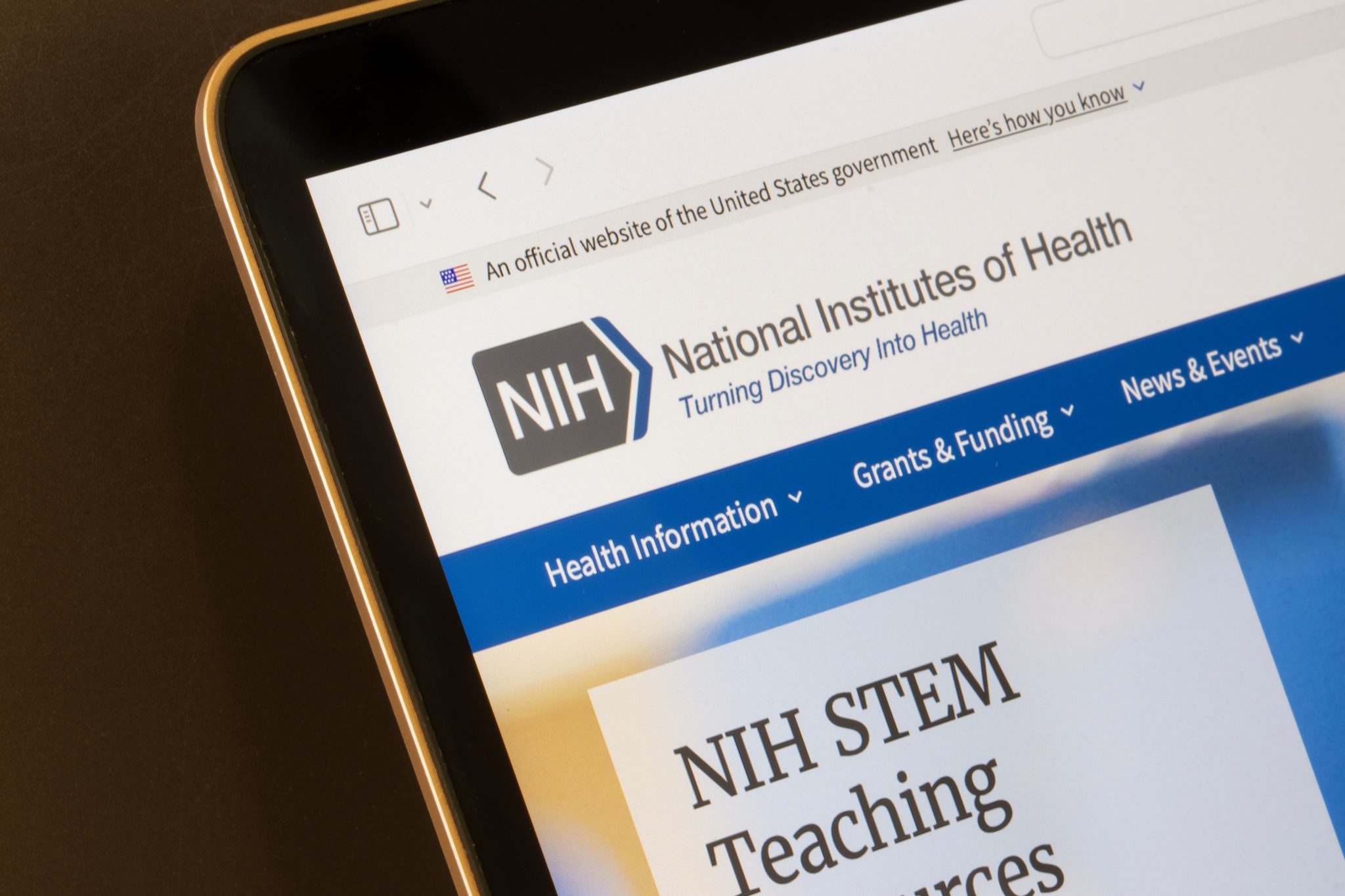 NIH website on tablet highlighting health info, grants, and funding for Auburn University at Montgomery researchers