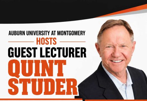 Auburn University at Montgomery hosts guest lecturer event; a smiling man in a suit on promotional banner.