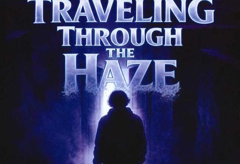 Auburn University at Montgomery poster: a person walks toward light under the blue title 'Traveling Through the Haze'.
