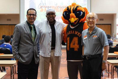 From left are AUM Associate Provost for Enrollment Management and Student Affairs Sameer Pande, Why Not Win Institute founder Larry Thornton Sr., Curtiss the Warhawk and College of Business Dean Daewoo Park.